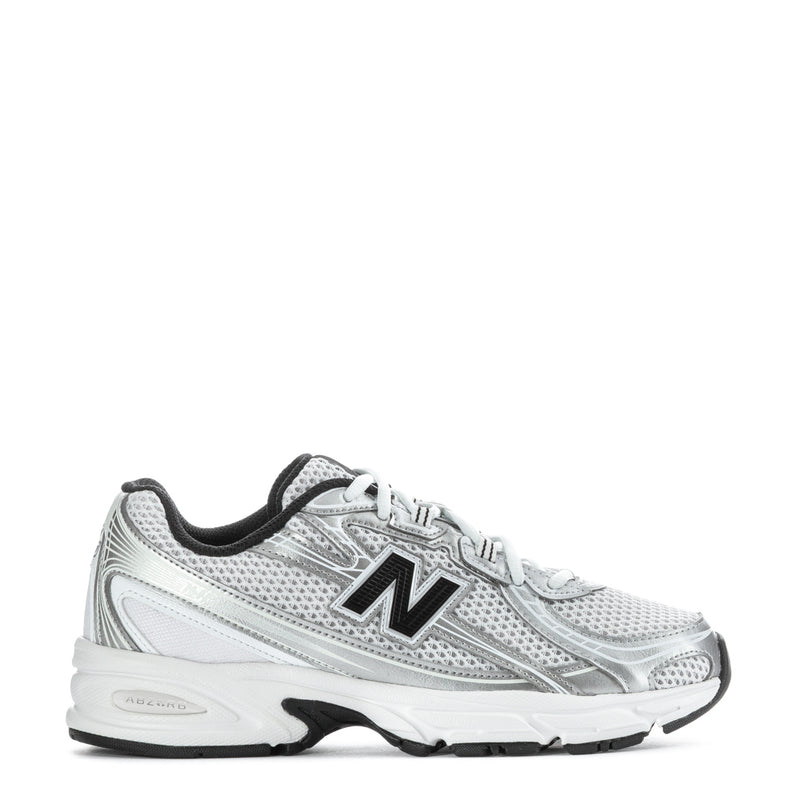 Silver youth running sneaker with black trim, mesh upper, New Balance 'N' logo