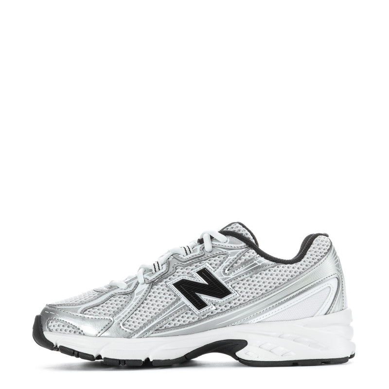 Silver youth running sneaker, side view, black heel tab, white laces