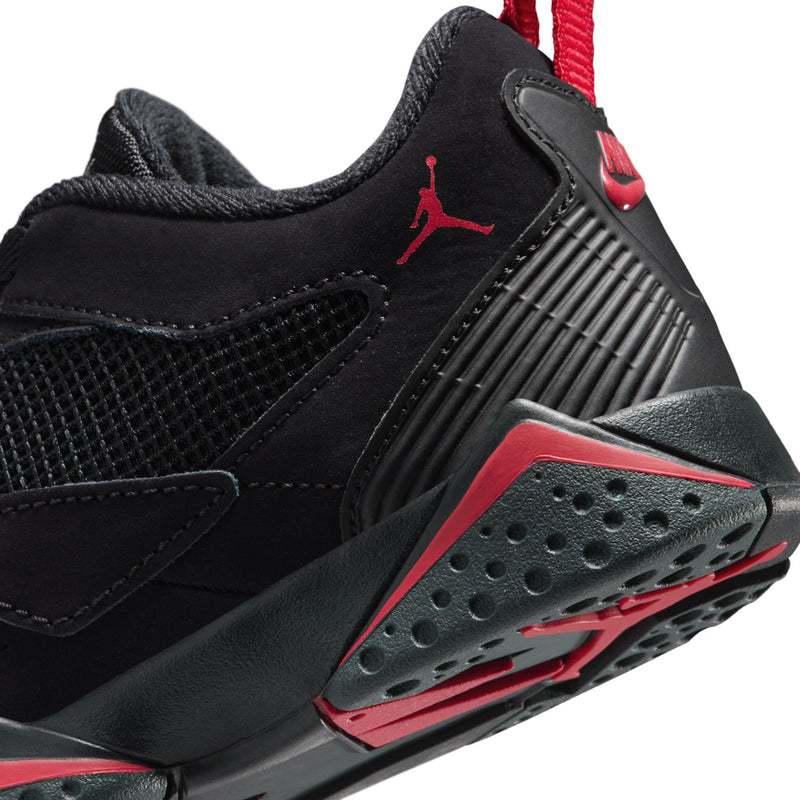 Kids black sneaker side with red trim, textured panel, and perforated sole