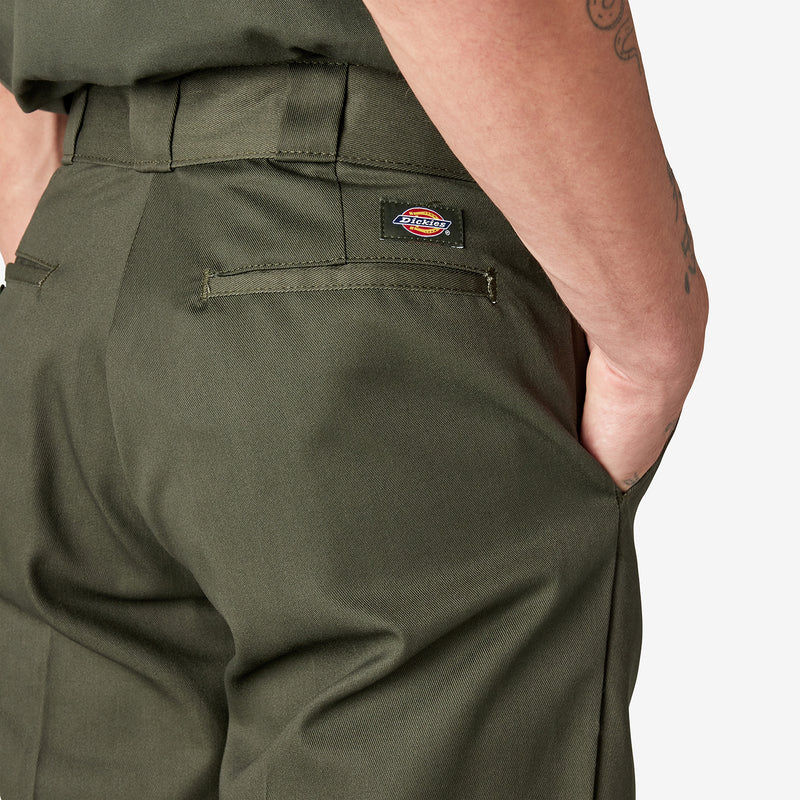 Olive green work pants with stitched front pocket and small logo patch.