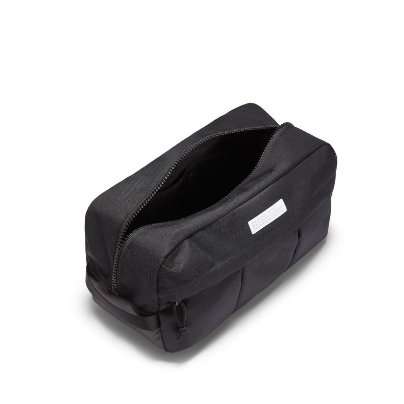 Black soccer shoe bag angled view with open top zipper and interior lining