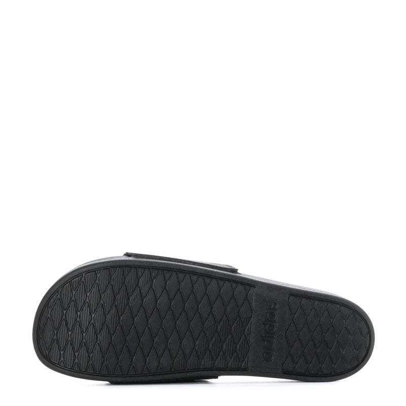 Men's black slide sandals, textured outsole tread view