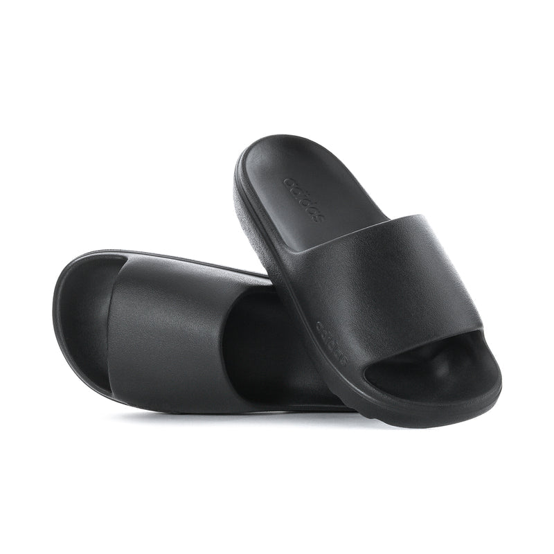 Black slide sandals with open toe and molded footbed; adidas logo on strap
