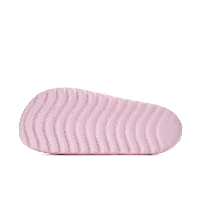 Clear pink slide sandal outsole with textured grip pattern