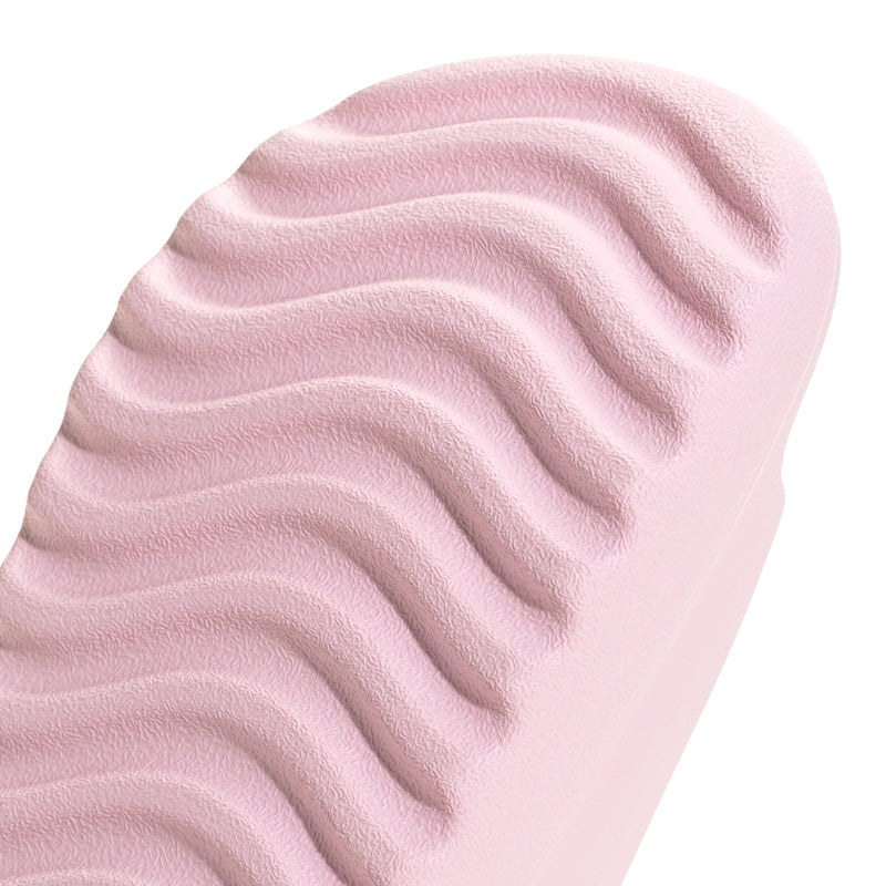 Clear pink slide sandal upper with soft wavy texture and ridged sole pattern