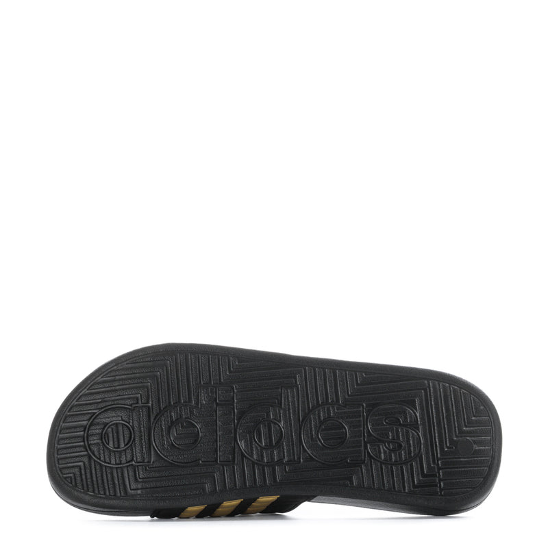 Men's black slide sandal outsole with embossed adidas logo pattern