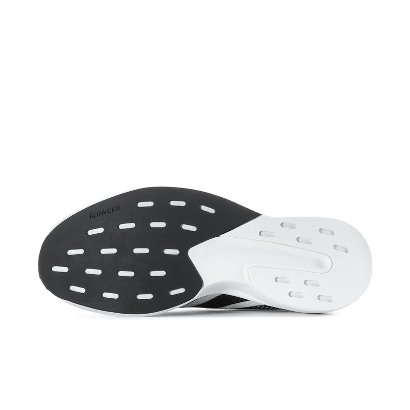Men's white running shoe outsole view with dark traction pods