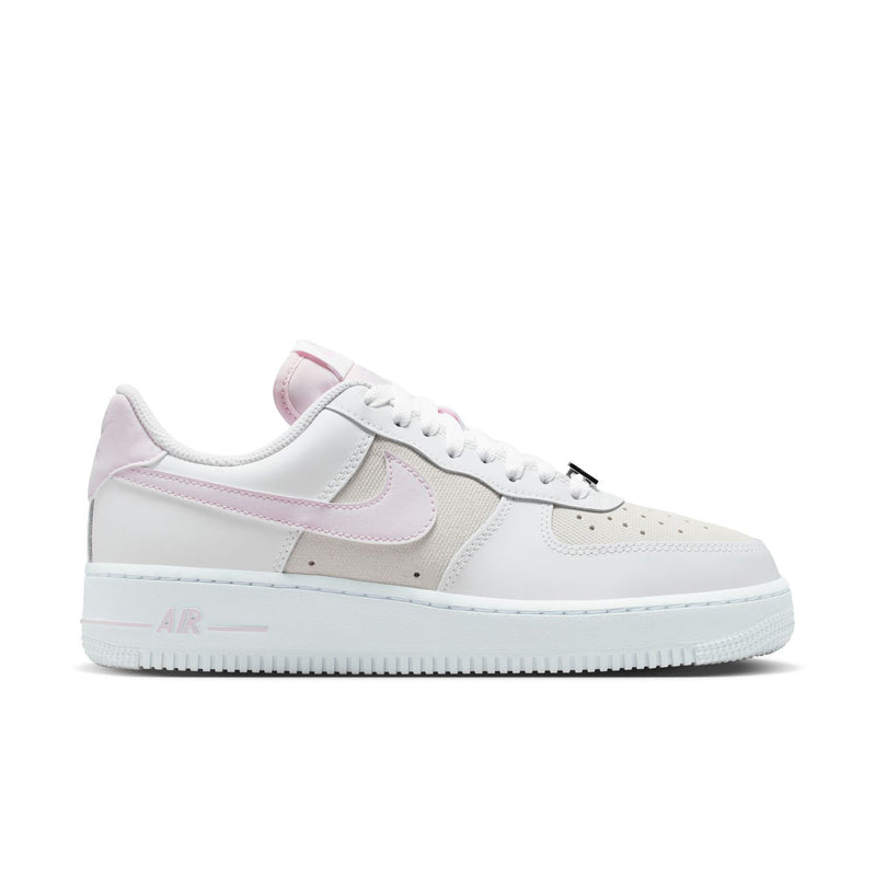 Women's Air Force 1 sneakers in white with lilac accents, front quarter view