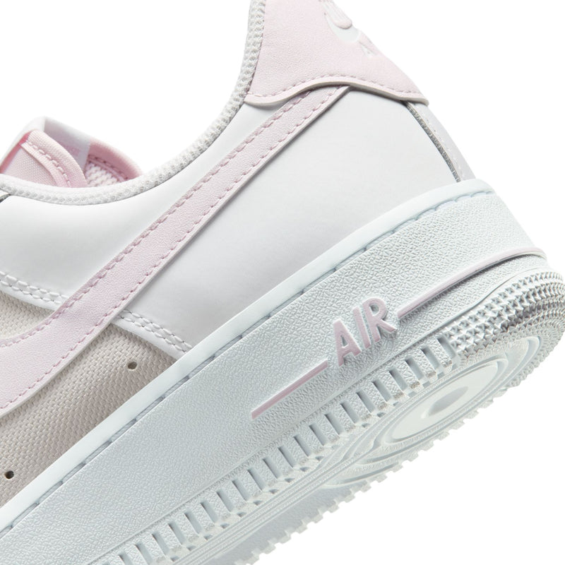 Women's Air Force 1 midsole close-up, white foam with lilac 'AIR' detail