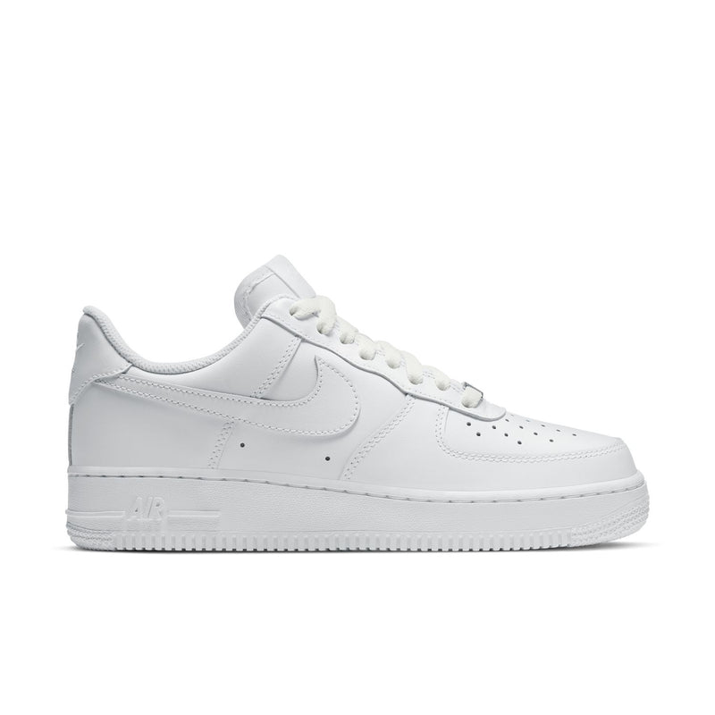 Women's white low-top sneakers, Nike Swoosh, lace-up leather