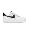 Women’s white low-top sneaker with black Swoosh and perforated toe box