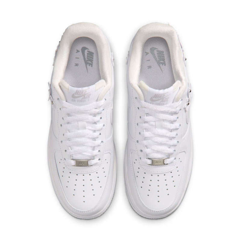 Pair of white Nike Air Force 1 sneakers shown from above with lace-up and perforated toe