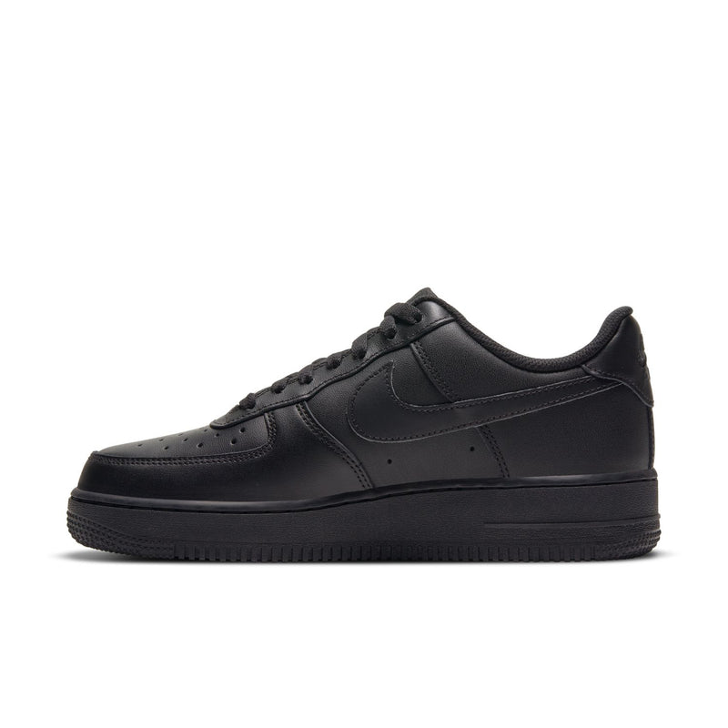 Black women’s low-top sneakers, front side view with perforated toe and swoosh
