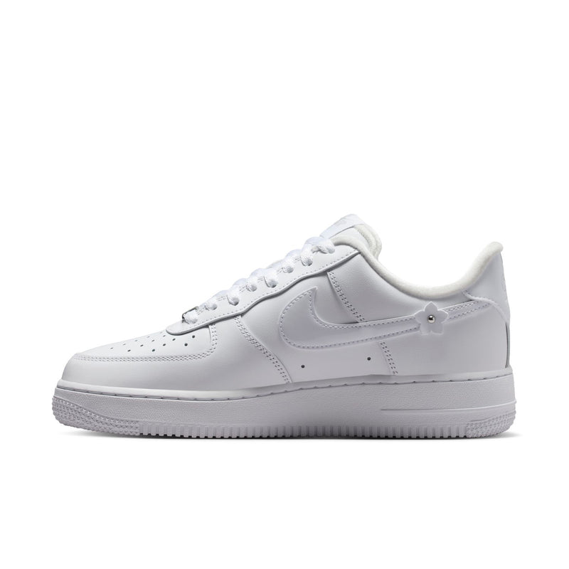 White Nike Air Force 1 low-top sneaker with lace-up, swoosh, and perforated toe