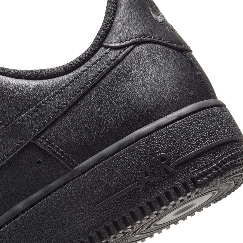 Black sneaker midsole close-up with AIR lettering and textured rubber outsole
