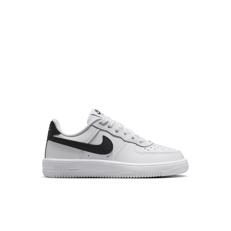 Kids' white leather sneakers with black swoosh and lace-up front