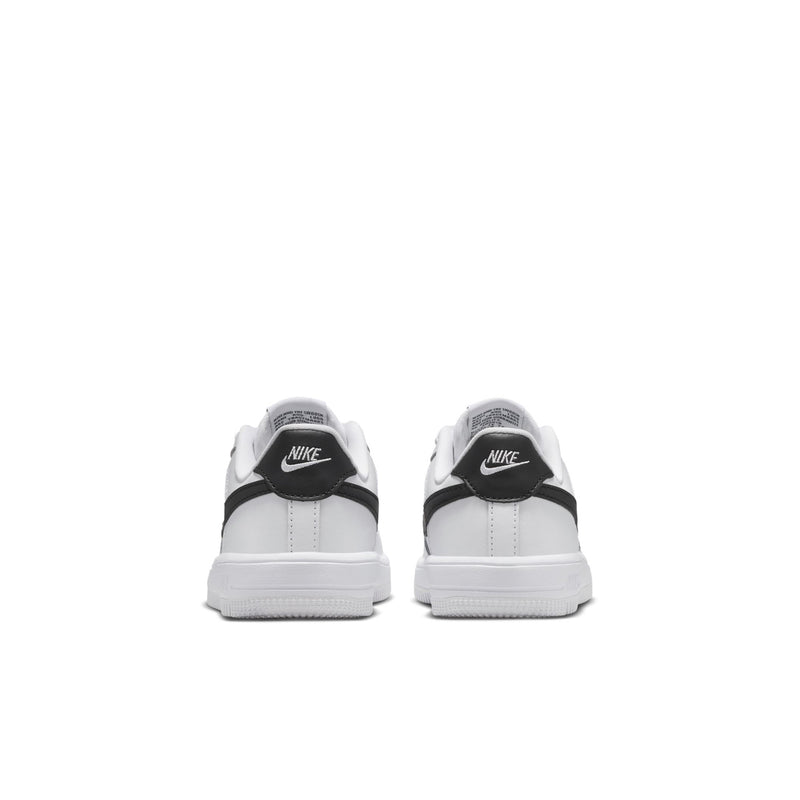Kids' white sneakers with black heel tab and cushioned back, rear view