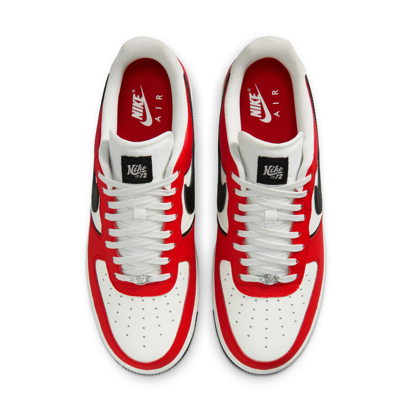 Men's low-top sneaker tongue and lace area with white laces, red lining, and black label
