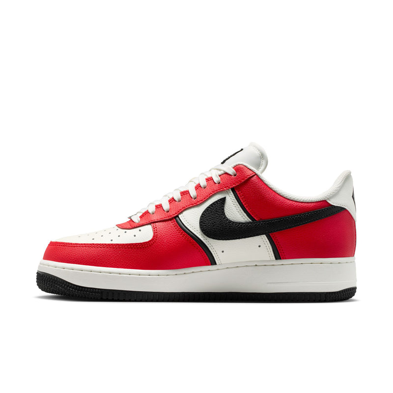 Men's low-top sneakers side view with red leather, black swoosh, and white midsole
