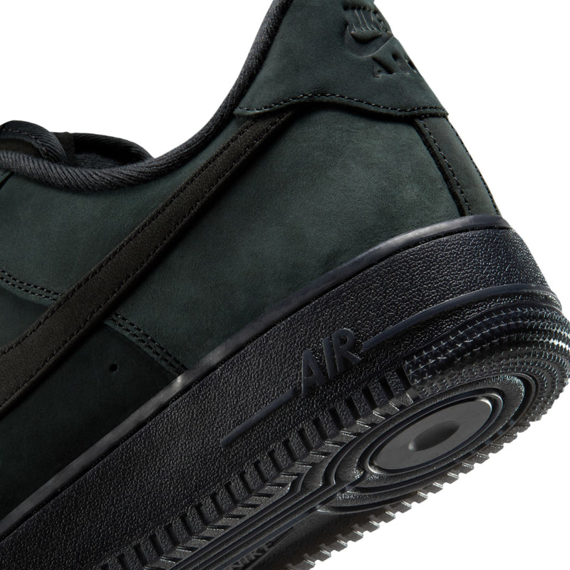 Men's Nike Air Force 1 Low midsole and outsole detail on dark green suede sneaker