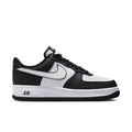 Nike Air Force 1 Low black and white sneakers, front-quarter view with perforated toe box