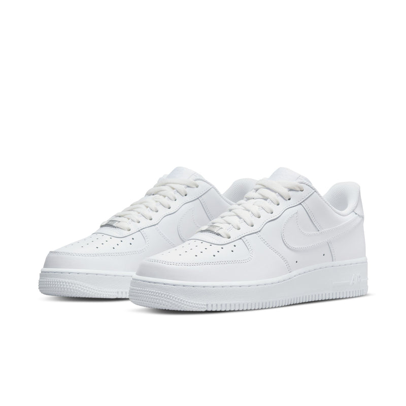 White lace-up low-top sneakers showing two pairs from the front