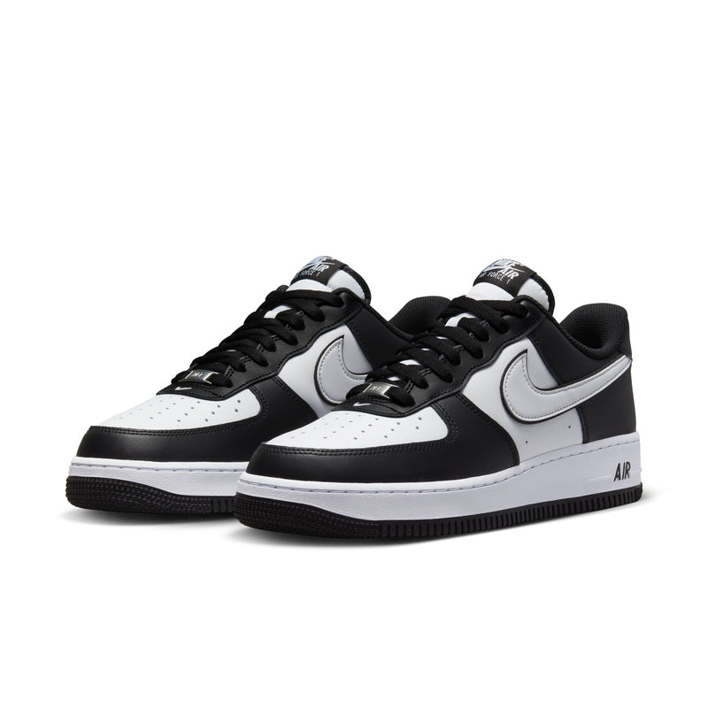 Nike Air Force 1 Low black and white sneakers, side view with swoosh and Air branding