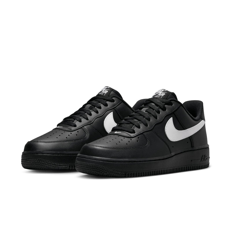 Nike Air Force 1 Low men’s sneakers in black with white swoosh, angled side view