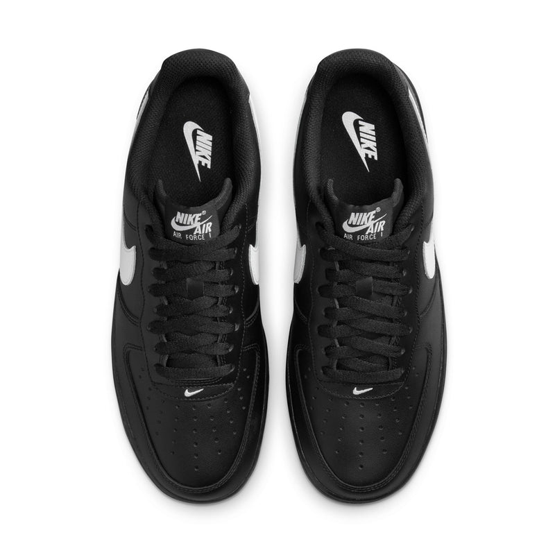 Nike Air Force 1 Low black sneakers with black laces and white swoosh on tongue