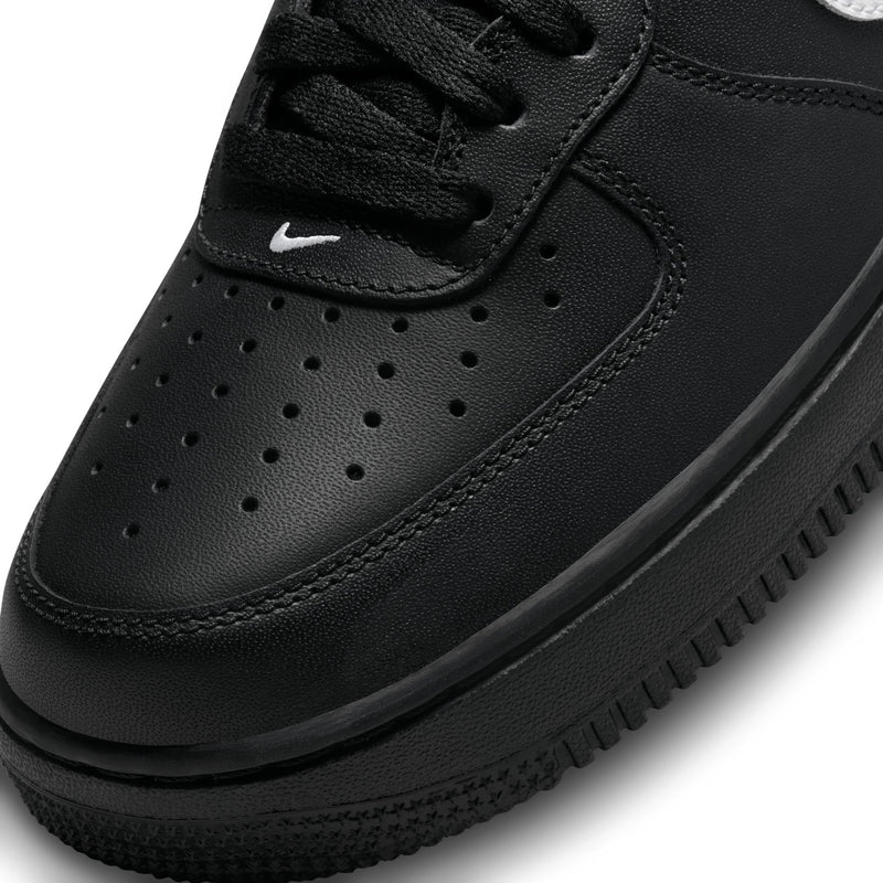 Nike Air Force 1 Low black toe box and laces close-up with perforation details