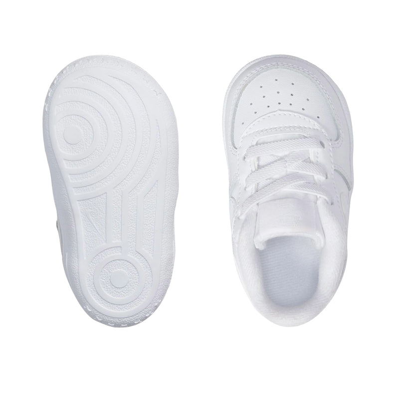 Infant white sneaker outsoles with textured tread and logo details
