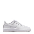 Kids low-top sneakers in white with lace-up closure and swoosh logo