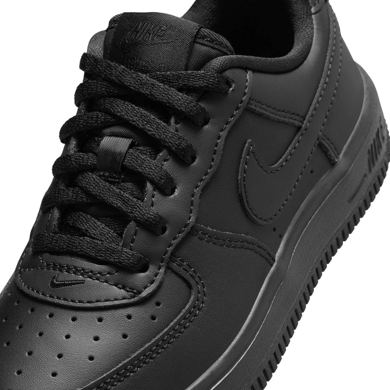 Kids' black Nike Air Force 1 low-top sneaker, close-up of laces and swoosh