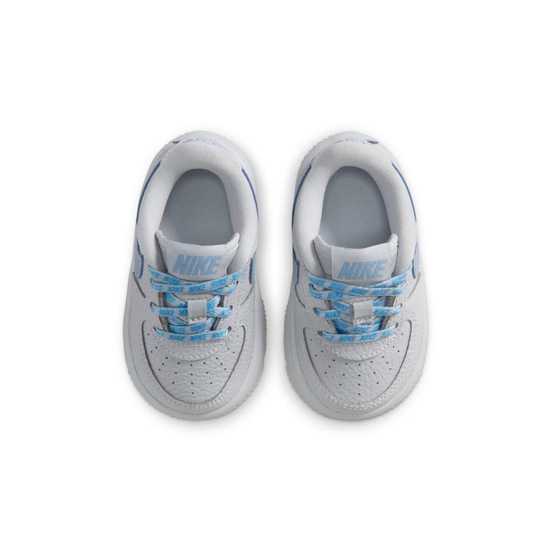 Toddler low-top sneakers, top view, gray uppers with blue laces and Nike logo