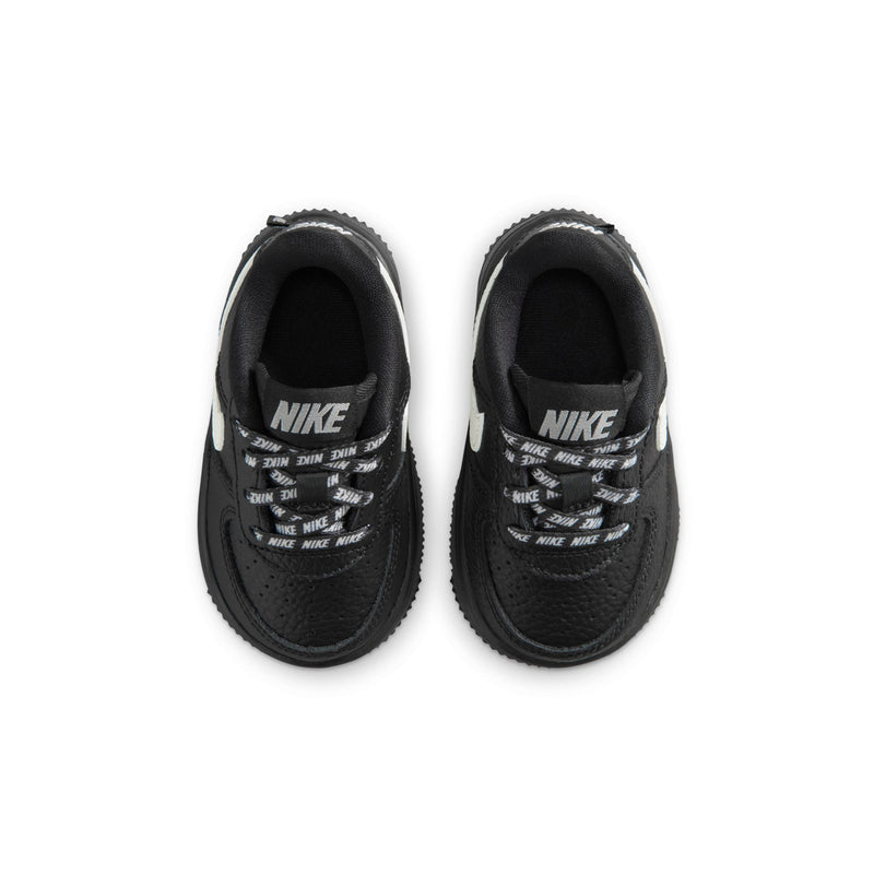 Black toddler low-top sneakers with Nike branding on the insides