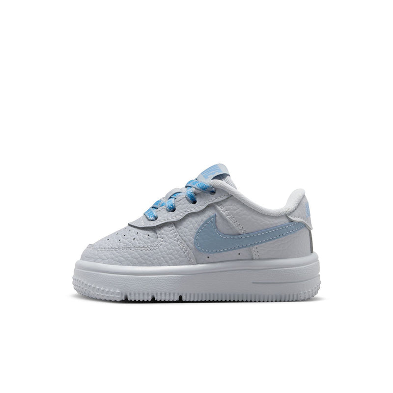 Toddler low-top sneakers, angled front, light gray leather with blue Swoosh detail