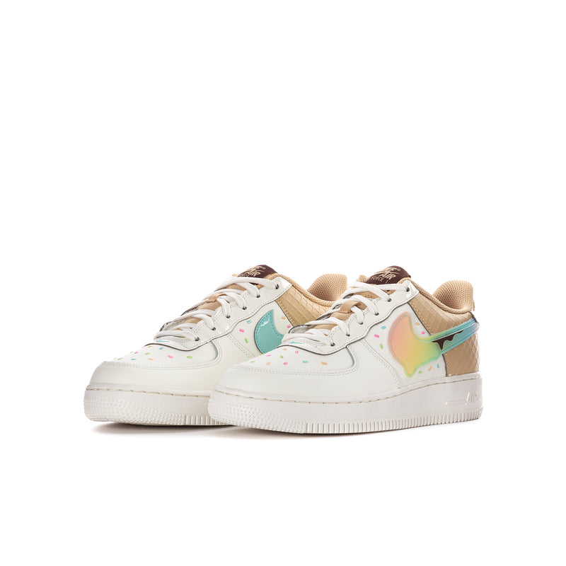 Youth low-top sneakers, white base with tan uppers, teal swoosh, and colorful overlays
