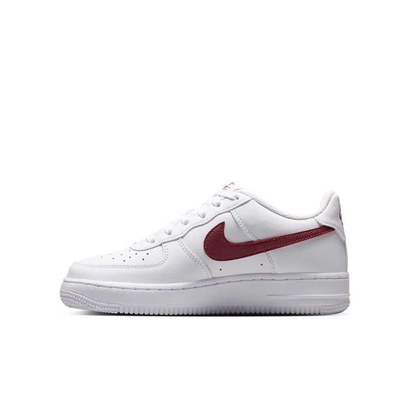 Youth low-top sneakers, white upper with burgundy swoosh and lace-up front