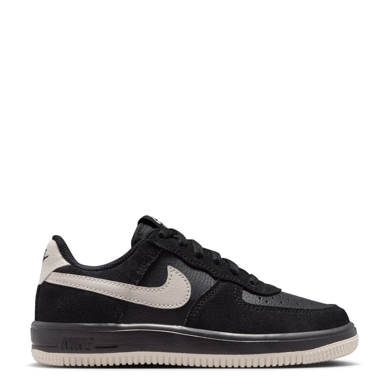 Kids black low-top sneaker side profile with light bone swoosh and lace-up