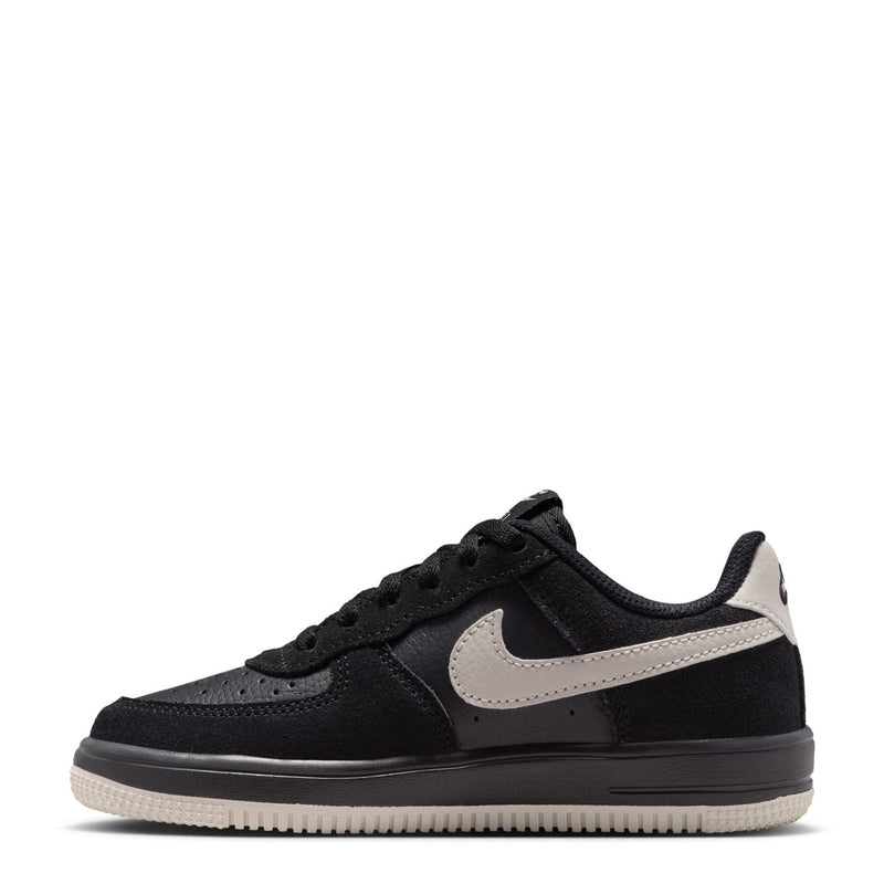 Kids low-top sneakers in black with light bone swoosh and lace-up closure