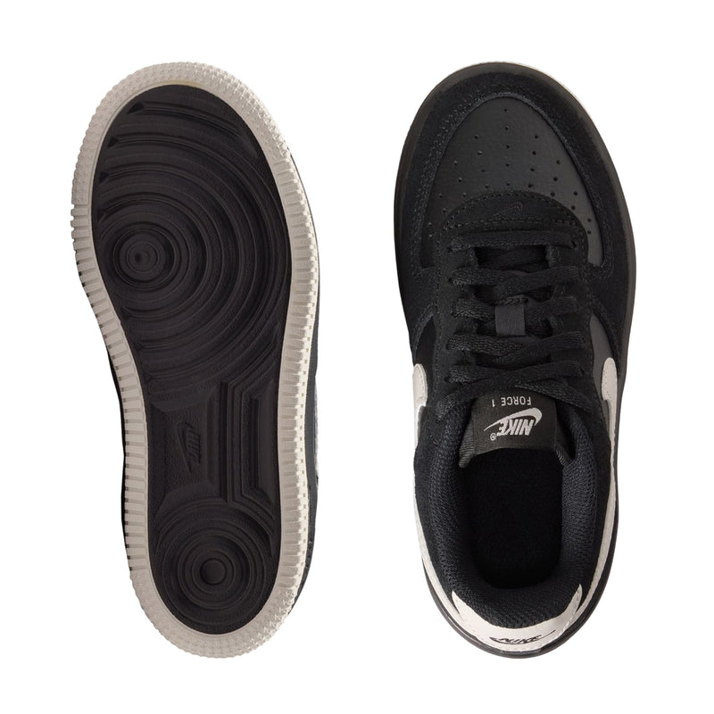Kids sneaker outsoles and inner view, black uppers with light lining