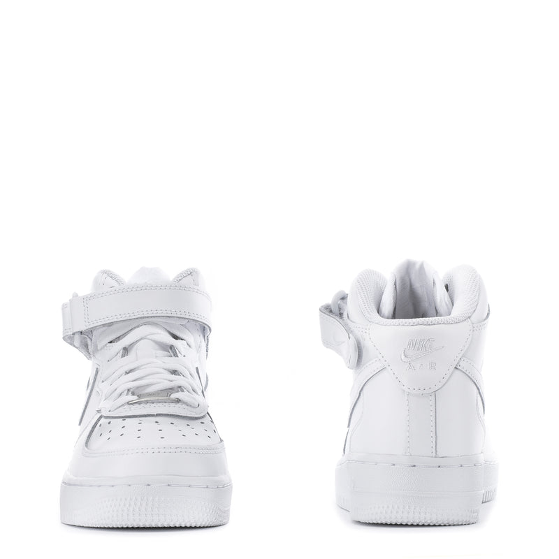 Youth white mid-top sneaker heel and toe, lace-up pair with padded collar