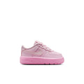 Pink toddler low-top sneakers with lace-up front and Nike-style swoosh on sides
