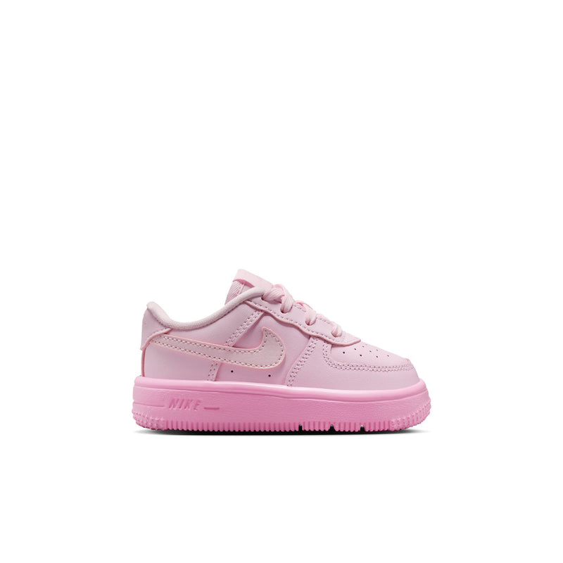 Pink toddler low-top sneakers with lace-up front and Nike-style swoosh on sides