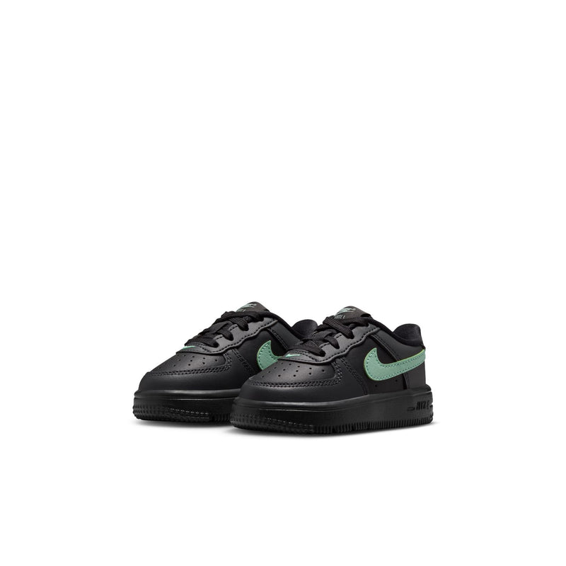 Toddler Nike Air Force 1 sneaker pair, black uppers with mint green accents and laces