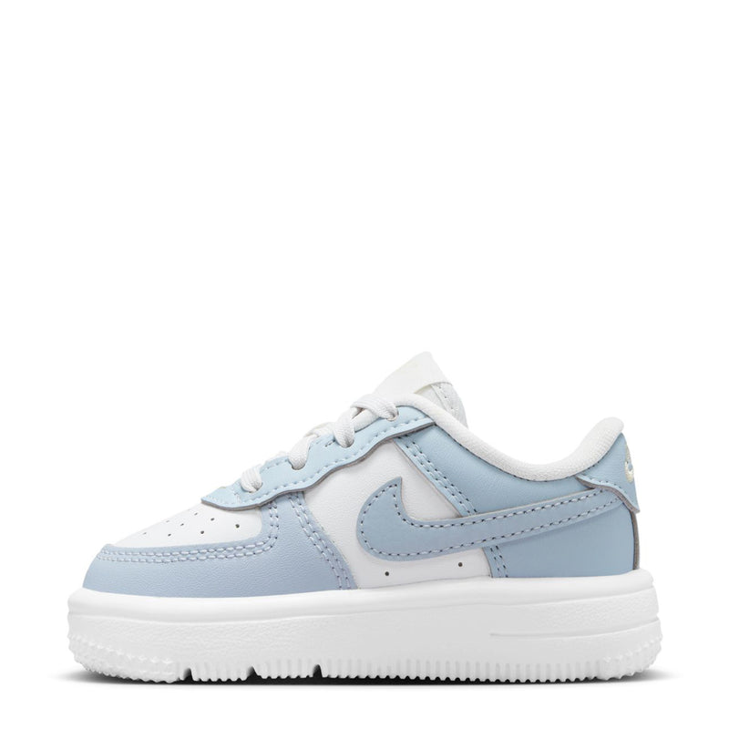 Toddler Nike Air Force 1 sneakers, light blue and white, side view with swoosh