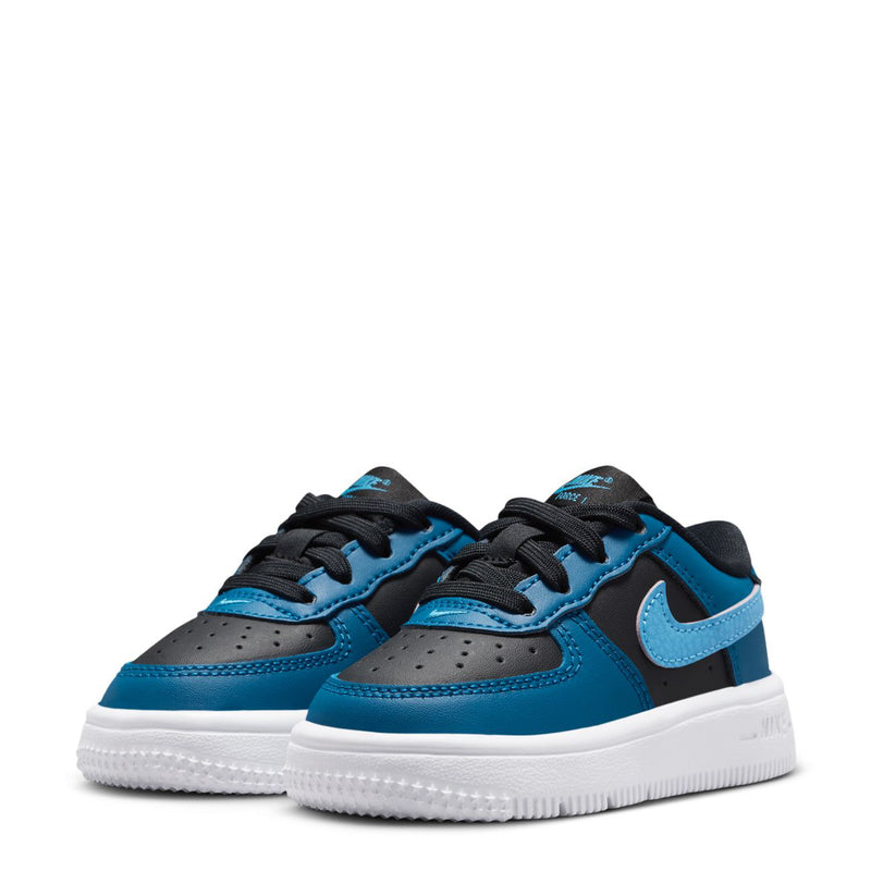 Pair of toddler Nike low-top sneakers in blue with black laces and white soles