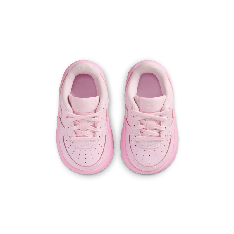 Pair of pink toddler sneakers with lace-up closure and padded interior collar