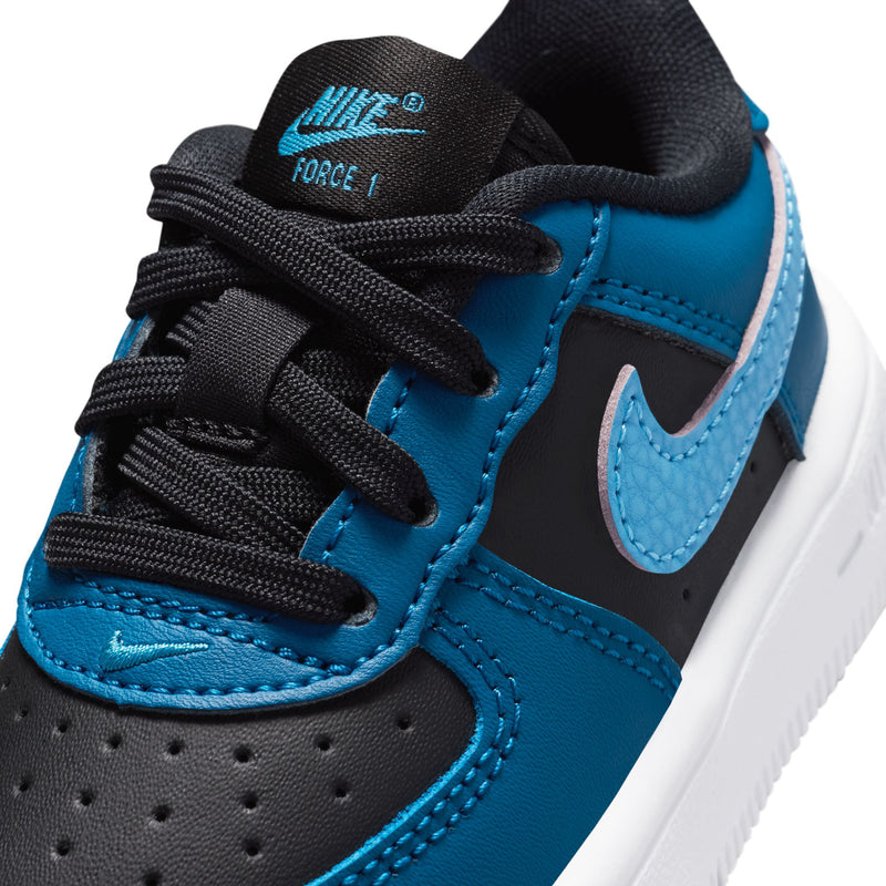 Toddler Nike sneaker close-up: blue panels, black laces, AIR FORCE 1 tongue