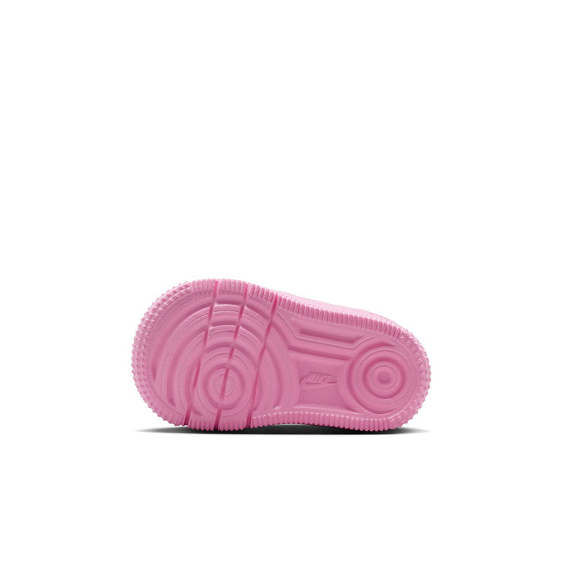 Pink toddler sneaker outsole with circular traction pattern and durable rubber tread